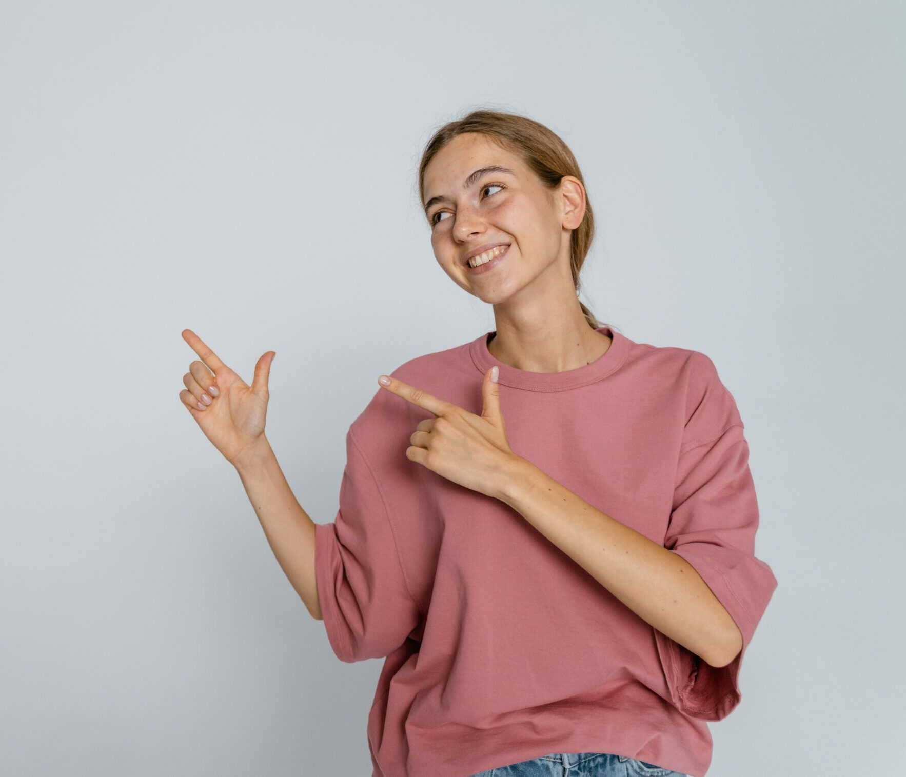 girl pointing left