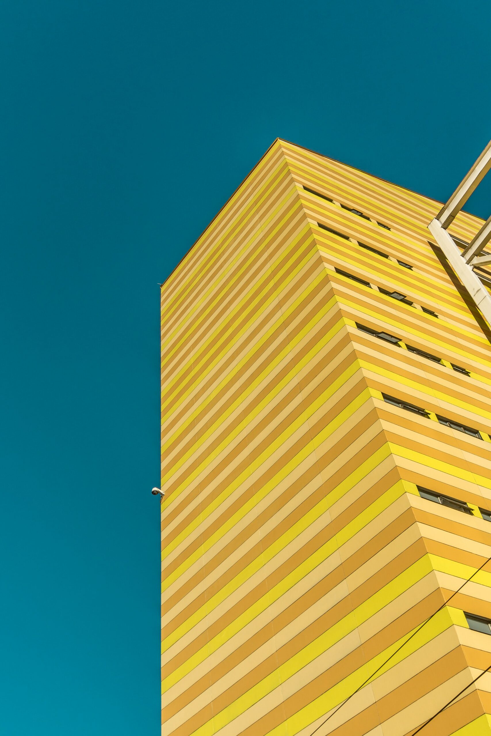 Yellow building with cladding