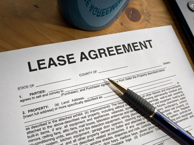 lease agreement document and a pen